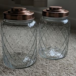 2 large glass canisters